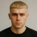 a man with french crop blonde hair