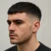 a man with short french crop haircut
